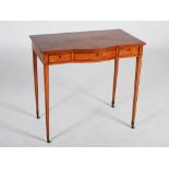 A late 19th century satinwood side table, the rectangular top above a bowed central frieze drawer