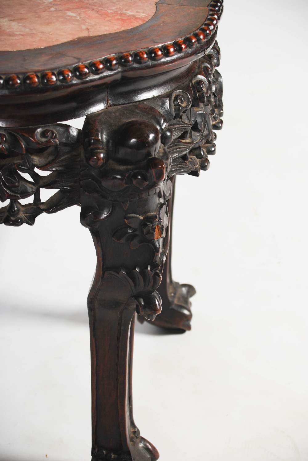 A Chinese dark wood jardiniere stand, late Qing Dynasty, the shaped octagonal top with a mottled red - Image 4 of 4
