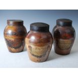 Three 19th century stoneware tobacco jars and covers, one inscribed on hand painted vignette 'RED