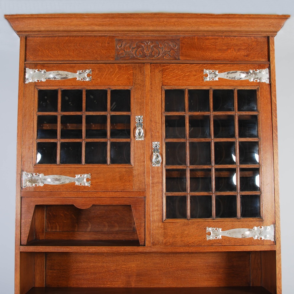 An oak Arts & Crafts style bureau bookcase, the moulded cornice above a plain frieze centred with - Image 7 of 7