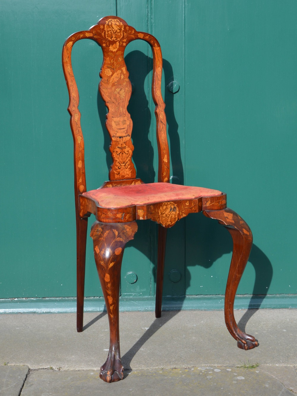 A tall late 19th/ early 20th century Dutch mahogany and marquetry inlaid side chair, the red leather