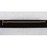 An 18ct gold Albert chain, stamped marks, 25.5cm long, 30.4 grams.