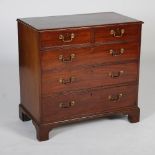 A George III mahogany chest, the rectangular top with a moulded edge above two short and three