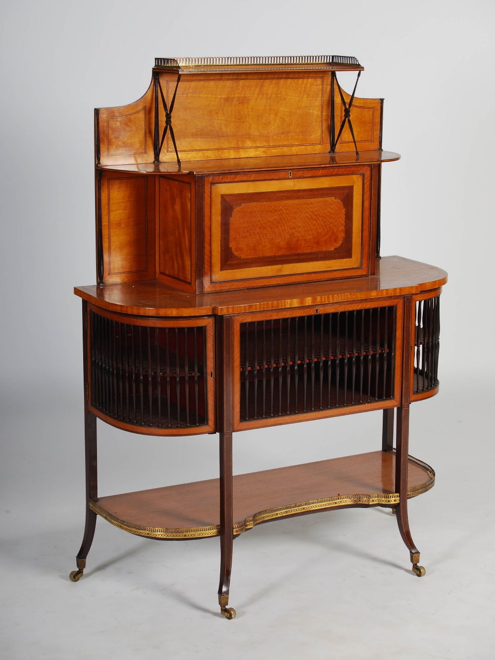 A 19th century satinwood and ebony lined bonheur de jour, the upper section with open shelf