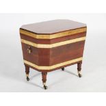 A 19th century mahogany and brass bound octagonal shaped wine cooler, the hinged top opening to a