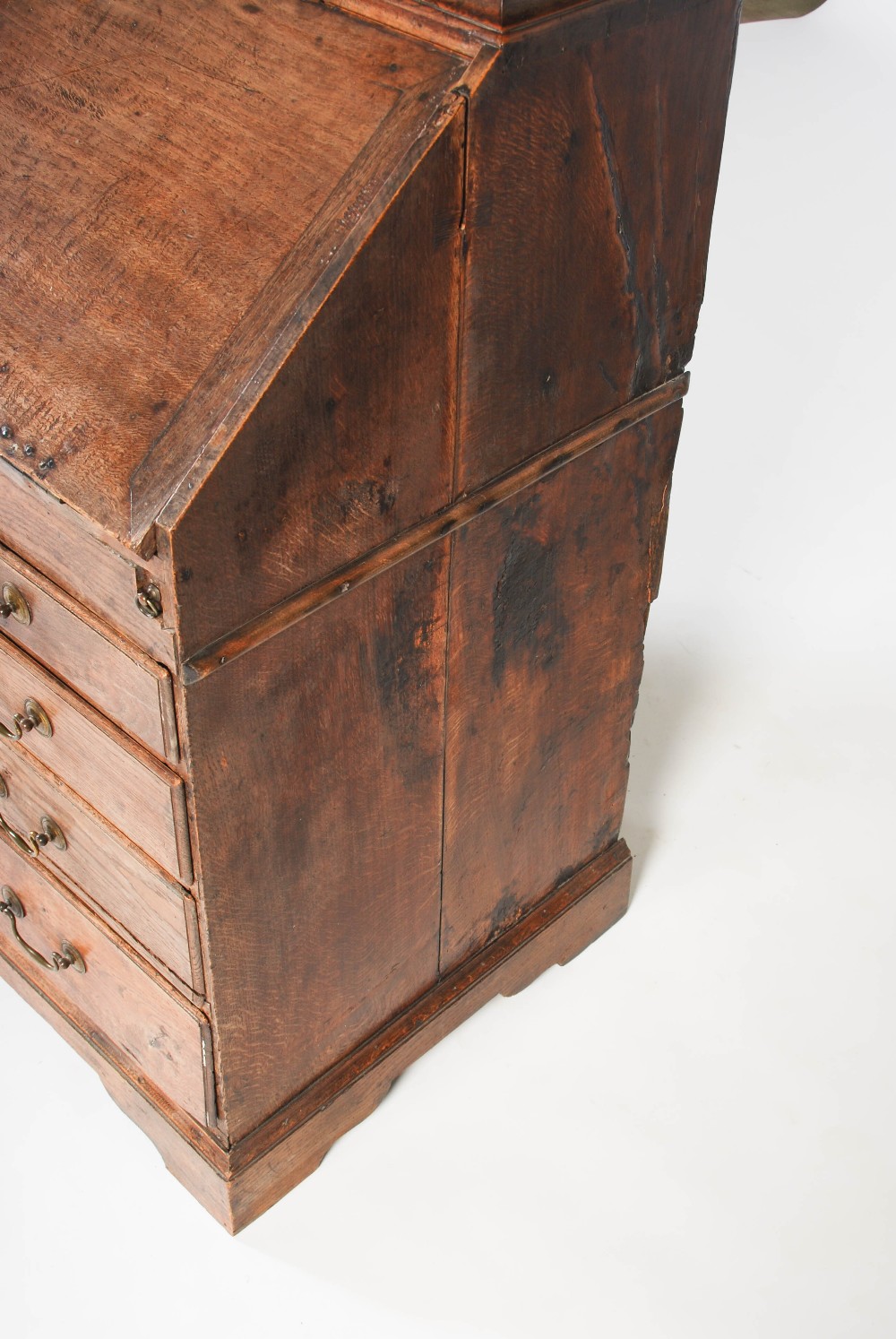 A George III oak bureau bookcase, the double domed moulded cornice above a pair of panelled cupboard - Image 6 of 6