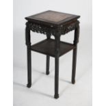 A Chinese dark wood jardiniere stand, Qing Dynasty, the square shaped top with a mottled purple