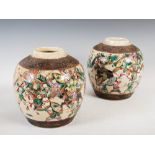A pair of Chinese porcelain famille rose crackle glazed jars, Qing Dynasty, decorated with