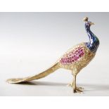 A fine Austrian silver gilt, gem set and enamel model of peacock, late 19th/ early 20th century, the