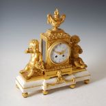 A late 19th century French ormolu and white marble mantel clock, the 4¼" white enamel dial with