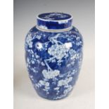 A Chinese porcelain blue and white jar and cover, six character Kangxi mark but later, decorated