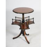 A Victorian amboyna and ebonised occasional table, the circular top raised on an ebonised column