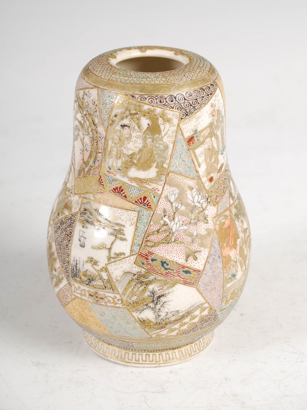 A Japanese Satsuma pottery gourd shaped vase, Meiji period, decorated with rectangular panels