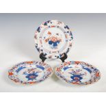 A pair of Chinese Imari porcelain plates, Qing Dynasty, decorated with urns issuing peony and