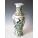 A Chinese famille verte porcelain vase, Qing Dynasty, decorated with rock work, peony, birds and