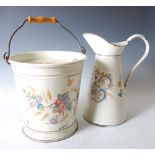 A late Victorian enamelled ewer and pail, the conical shaped ewer decorated with yellow roses and