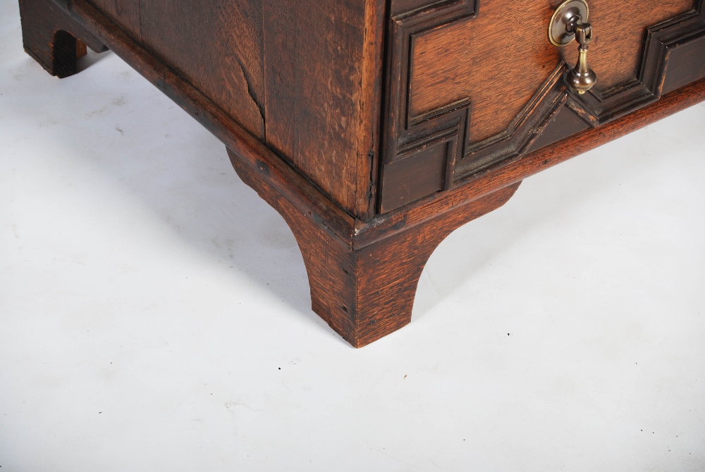 A Charles II style oak chest, the rectangular top with a moulded edge above four long drawers with - Image 4 of 5