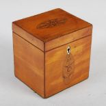 A George III satinwood and marquetry inlaid tea caddy, the hinged rectangular top inlaid with oval