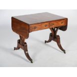 A 19th century mahogany, rosewood and boxwood lined sofa table, the rounded rectangular top with