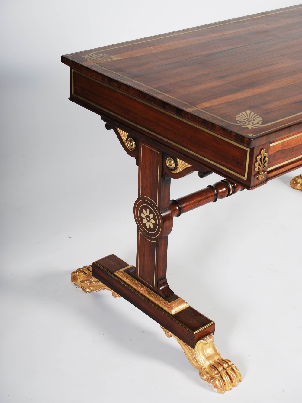 A Regency rosewood, brass inlaid and gilt wood library table, the rectangular top with a brass - Image 2 of 7