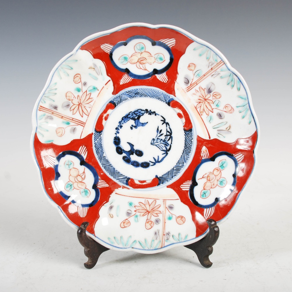 A set of three Japanese Imari plates, decorated with panels of flowers and birds, 21.5cm diameter, - Image 12 of 15