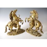 After Guillaume Coustou, a pair of late 19th century gilt bronze figures of the Marley horses, 36.