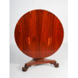 A 19th century Goncalo Alves snap top breakfast table, the hinged circular top above a plain