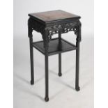 A Chinese dark wood jardiniere stand, Qing Dynasty, the square top with mottled red marble insert,