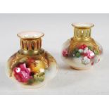 A matched pair of Royal Worcester hand painted vases, dated 1909 and 1913, the earlier vase