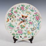 A Chinese porcelain famille rose dish, late Qing Dynasty, decorated with peony, birds and