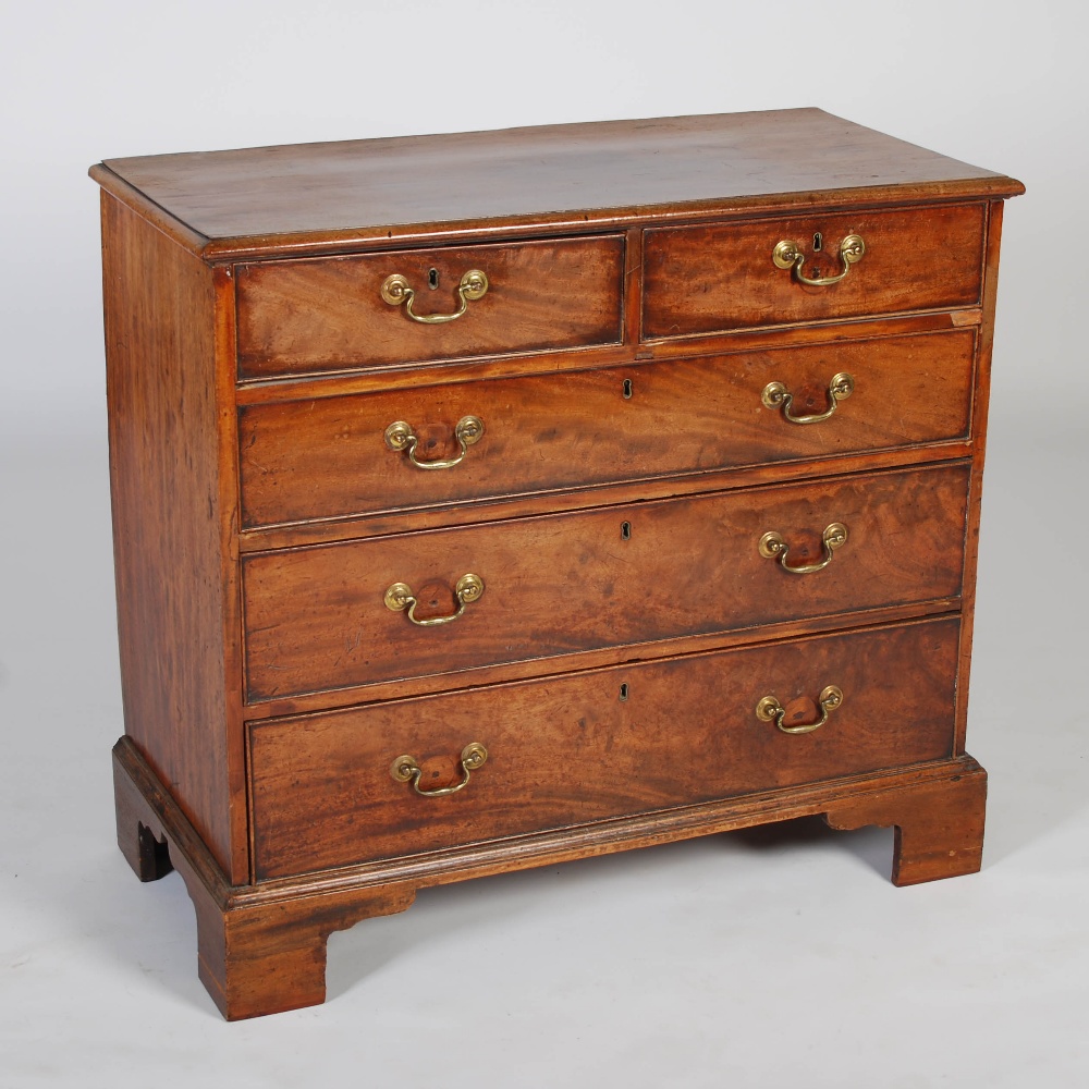 A George III mahogany chest, the rectangular top with a moulded edge, above two short and three long