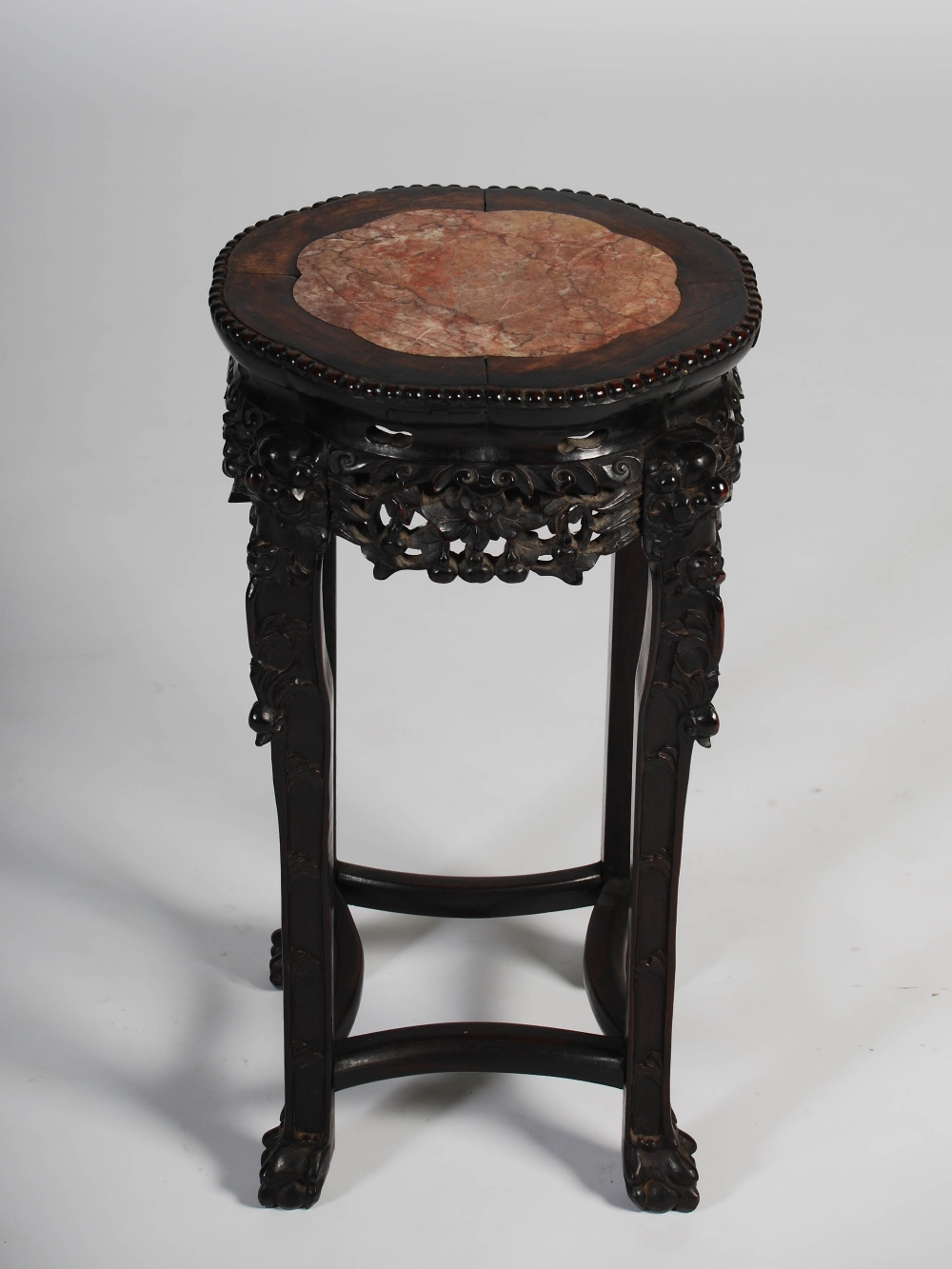 A Chinese dark wood jardiniere stand, late Qing Dynasty, the shaped octagonal top with a mottled red - Image 2 of 5