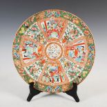 A Chinese porcelain famille rose charger for the Islamic market, Qing Dynasty, the central
