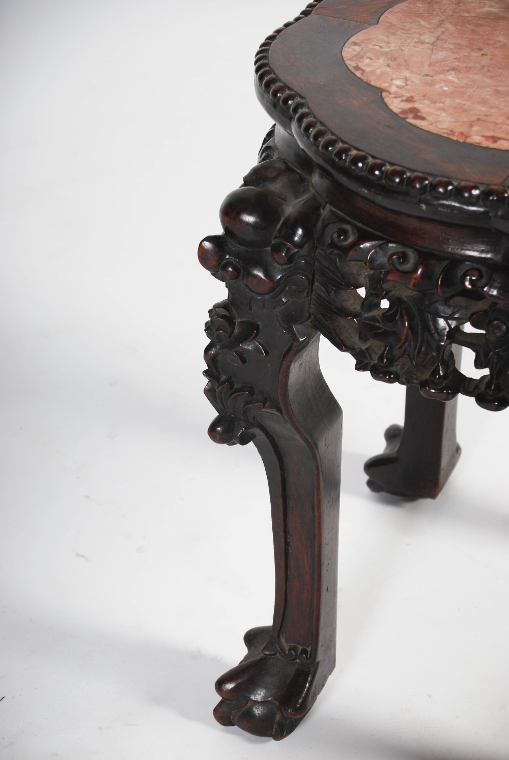 A Chinese dark wood jardiniere stand, late Qing Dynasty, the shaped octagonal top with a mottled red - Image 3 of 4