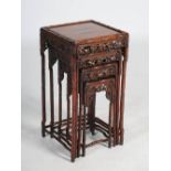 A quartetto of four Chinese dark wood occasional tables, Qing Dynasty, the square panelled top