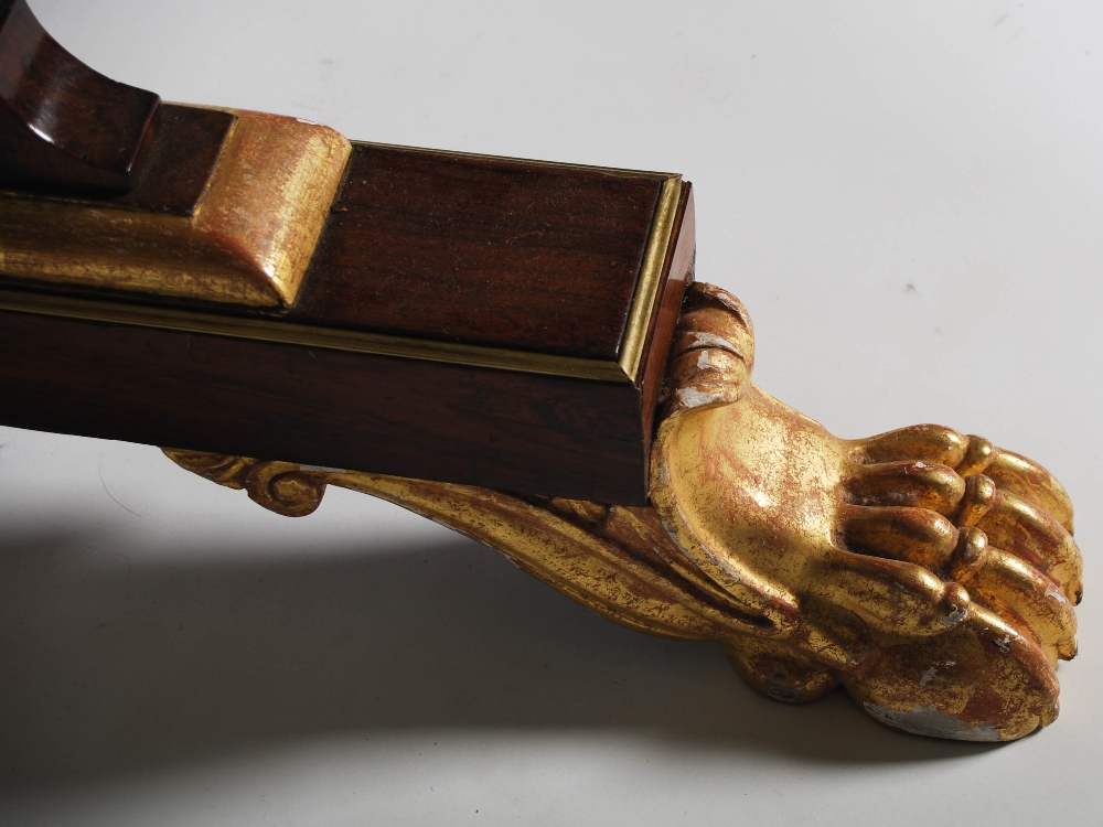 A Regency rosewood, brass inlaid and gilt wood library table, the rectangular top with a brass - Image 4 of 7