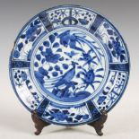 A Japanese blue and white porcelain Arita dish, decorated with birds, flowers and fruit within a