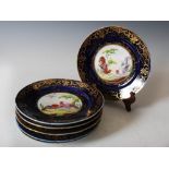 A set of six early 19th century English cobalt blue ground ornithological dessert/ fruit plates,