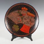 A late 19th/early 20th century Japanese porcelain cloisonne charger, decorated with urn and fan on a