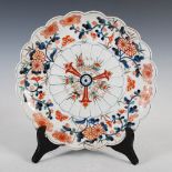 A late 19th/early 20th century Japanese Imari charger, of lobbed circular form, the centre decorated