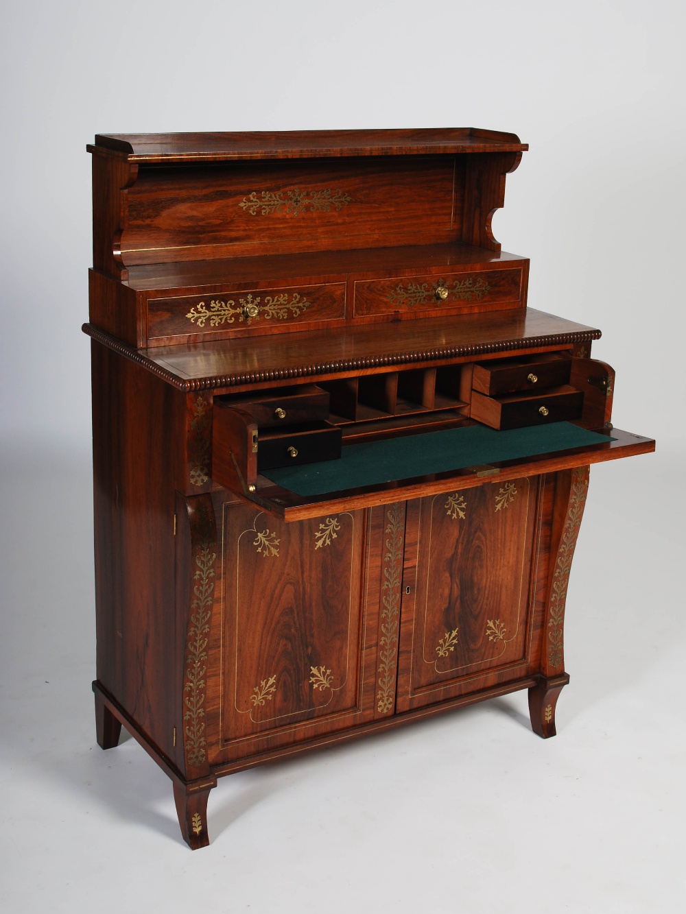 A 19th century Regency style rosewood and brass inlaid secretaire chiffonier, the upper section with