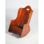 A George III mahogany child's rocking chair, the back with pierced cut out, on concave rockers,