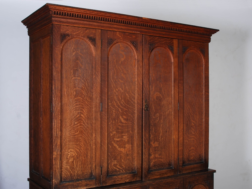 A Victorian oak cupboard, the moulded cornice and dentil frieze above a pair of double hinged, - Image 3 of 6