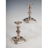 A pair of George V silver candlesticks, London, 1910, makers mark of TB&S, of Georgian design with