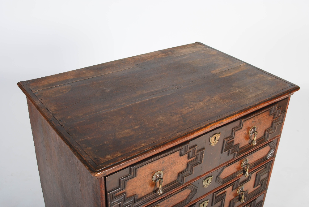 A Charles II style oak chest, the rectangular top with a moulded edge above four long drawers with - Image 2 of 5