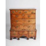 A William & Mary walnut chest on stand, the rectangular top with moulded edge above two short and