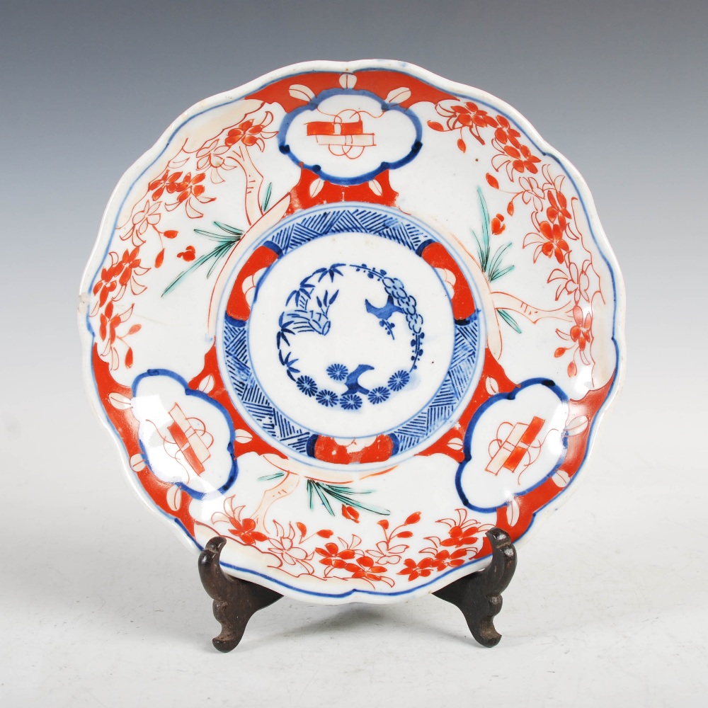 A set of three Japanese Imari plates, decorated with panels of flowers and birds, 21.5cm diameter, - Image 8 of 15