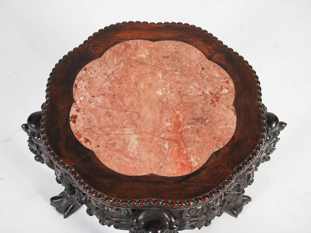 A Chinese dark wood jardiniere stand, late Qing Dynasty, the shaped octagonal top with a mottled red - Image 2 of 4
