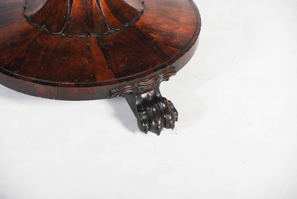 A 19th century rosewood snap top dining table, the hinged circular top raised on a tapered octagonal - Image 4 of 6