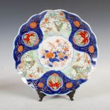 A Japanese Imari porcelain charger, early 20th century, the central roundel decorated with peony